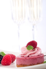 Delicious raspberry cheesecake served fresh raspberries