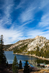 Nice view to lake hidden inside mountains dramatic skyview