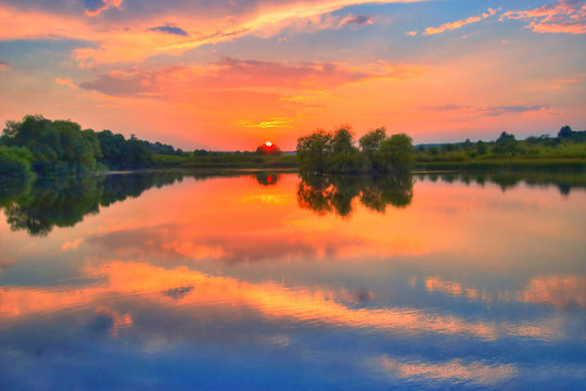 An image of sunrise on a lake