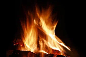 Papier Peint photo Flamme Close-up of fire and flames on a black background