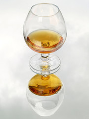 Brandy glass reflected in mirror