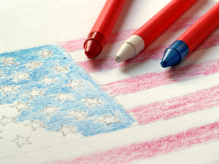 Partially complete drawing of US flag with wax crayons