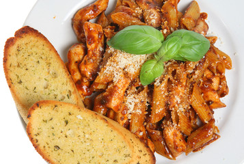 Penne pasta meal with garlic bread