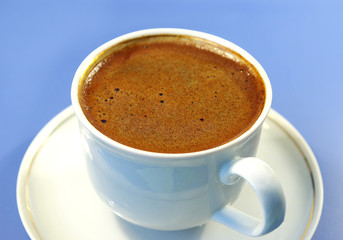 black coffee in the white cup. blue backgrounds