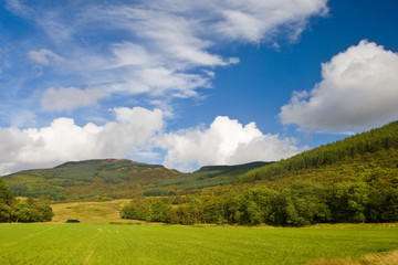 Fototapeta na wymiar A mountain landscape with cloudy sky in Scotland
