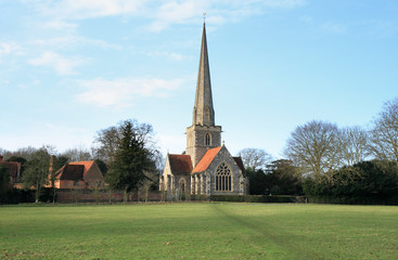 Fototapeta na wymiar Medieval English Rural Church with a tall Steeple 
