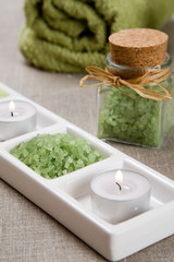 Obraz na płótnie Canvas Green bath salt and candles
