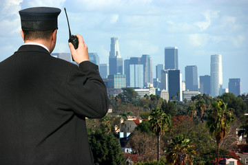 Security agent watching Los Angeles from hilltop