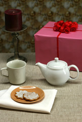 A party table set with cookies and tea