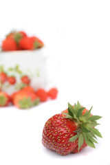 strawberry and pot with strawberries on the white background