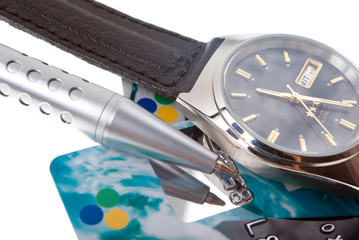 Fototapeta premium Close up of credit card .Wrist watch with dark dial