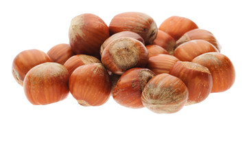 heap of shelled hazelnuts isolated on white