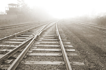 Obraz premium Rail road. Vanishing point. Sepia tone photo.