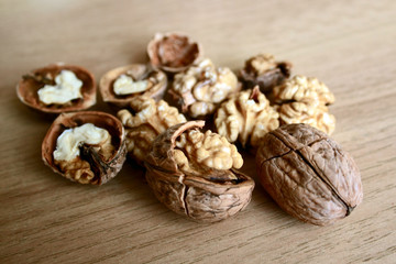 Fototapeta na wymiar cracked nuts on wooden table