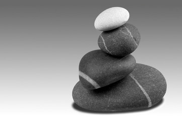 Black and white image of a pebble sculpture.