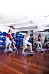 Fototapeta na wymiar girls stepping in a fitness center