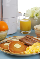 A country breakfast served with fresh juiced oranges