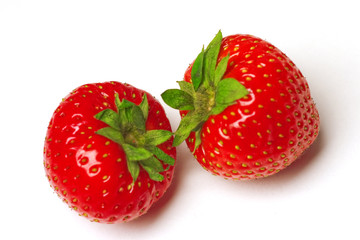 Two appetizing brightly red strawberries