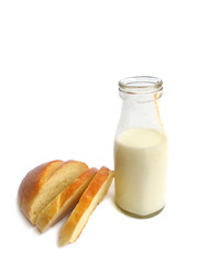Old fashioned milk bottle with bread