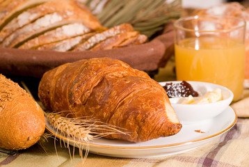 Breakfast - Rustic various baked bread with orange juice