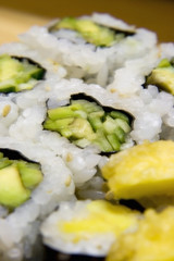 White plate full of japanese food.