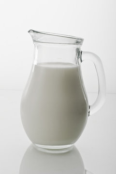 drink series: jug with milk over white