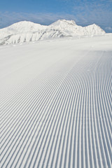 Snow grooming machine tracks © kreego