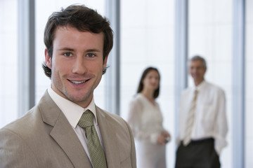 Smiling and confident young businessman