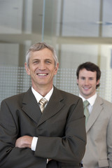 Mature businessman with colleague