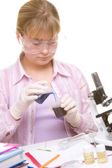 Student performing chemistry experiments liquids. 