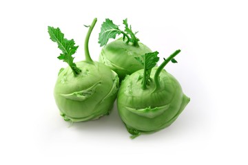 Three kohlrabi heads on a white background
