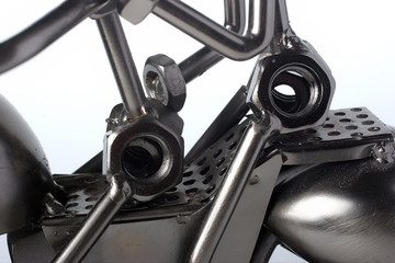 detail of silver motorcycle build from screw