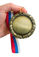 gold medal in hand isolated over white