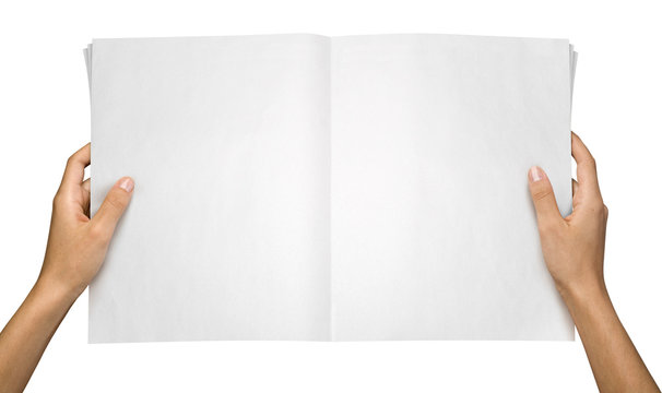 Hands holding a blank tabloid, suitable for pasting anything