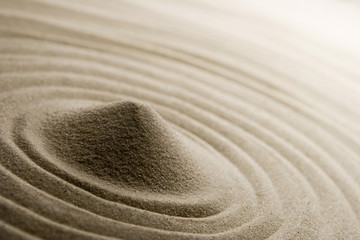 Pile of sand on raked sand