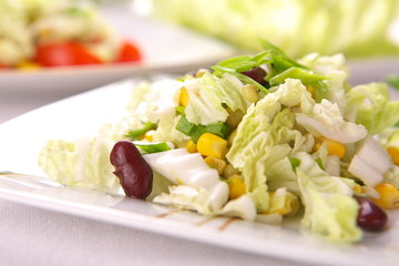 Fresh salad with corn and basil