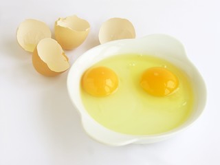 two raw hen eggs