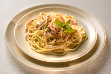 spaghetti with cheese and prosciutto close up shoot