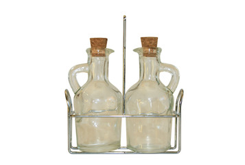 Two small decanters on a metal support.