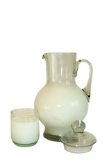 Jug filled by milk on a white background