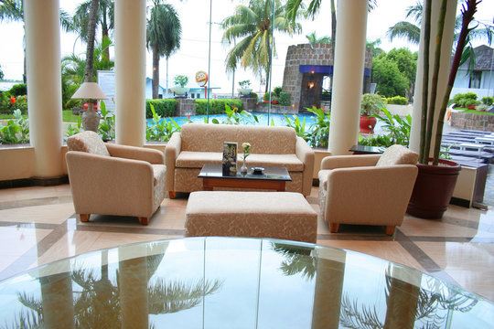 set of sofa near pool