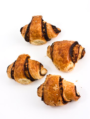 Croissant by a breakfast on a white background