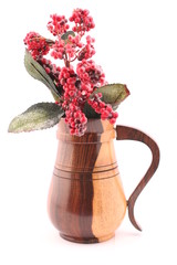 red frosted cherry berries in a wooden glossy jug