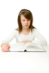 Portrait of Happy young schoolgirl reading book