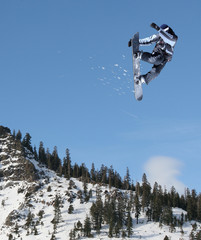 Snowboarder jumping high at Lake Tahoe resort