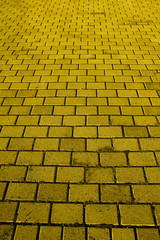 A background texture of a yellow brick road