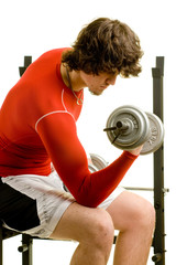 A young man lifting weights over a white background.