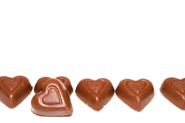 A line of delicious heart shaped milk chocolates.