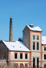 Old ruined factory in winter