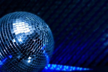 discoball in night club, low DOF, copy space on right